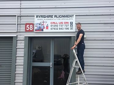 The Ayrshire Alignment sign going up above the door of Unit 58